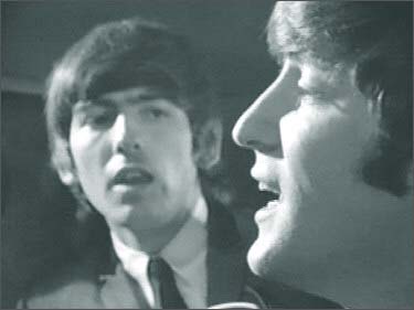 John Lennon and George Harrison in A Hard Day's Night: John sings I Should Have Known Better in the train baggage car. Lennon's famous profile is well-known by Beatles fans around the world.