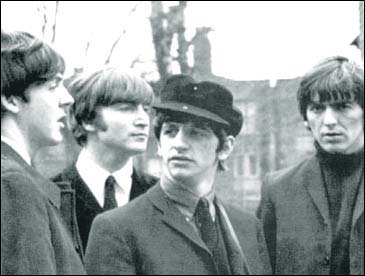 The Beatles in A Hard Day's Night: Paul McCartney, John Lennon, Ringo Starr and George Harrison wait for action to begin on a scene from their first feature film.
