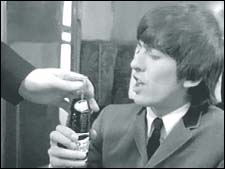 George Harrison in A Hard Day's Night: George takes a Pepsi from Shake in one of the train scenes from A Hard Day's Night.