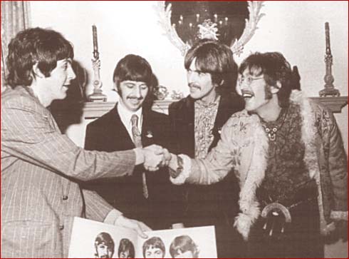 John and Paul shake hands