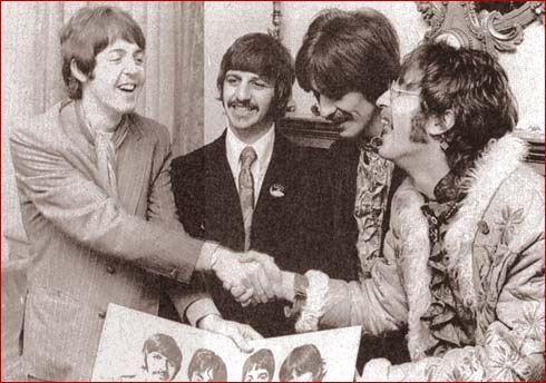 John and Paul shake hands